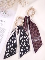 کش مو مرواریدی دنباله دار